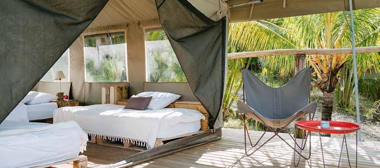 Situated on the bank of Grande Rivière South East, 12 comfortable 50 square meter safari tents