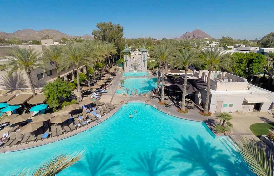 P L AY With its distinctive Frank Lloyd Wright-inspired architecture, 92-foot waterslide, eight pools, six tennis courts, two 18-hole