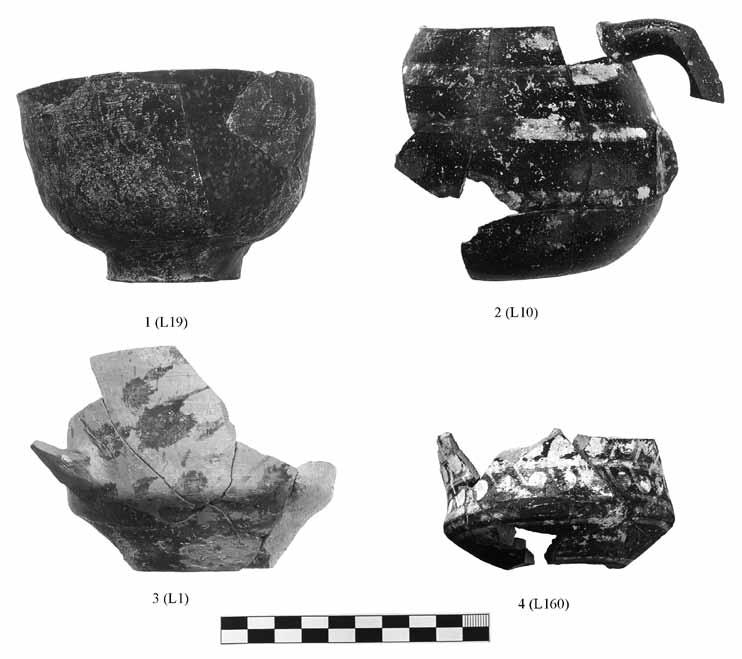 Fig. 7. Large fragments of rough burnished (1), whiteon-dark (2), spatter (3), and polychrome (4) ware vessels.
