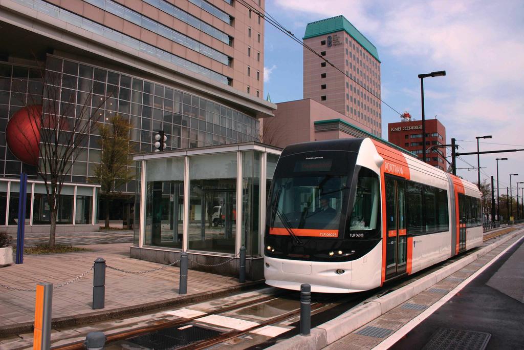 (Photos: Toyama Light Rail) Two-car Series TLR0600 running with mountains on background Iwasehama