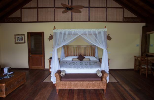 Seychelles. Master bedroom with four-poster bed and a balcony.