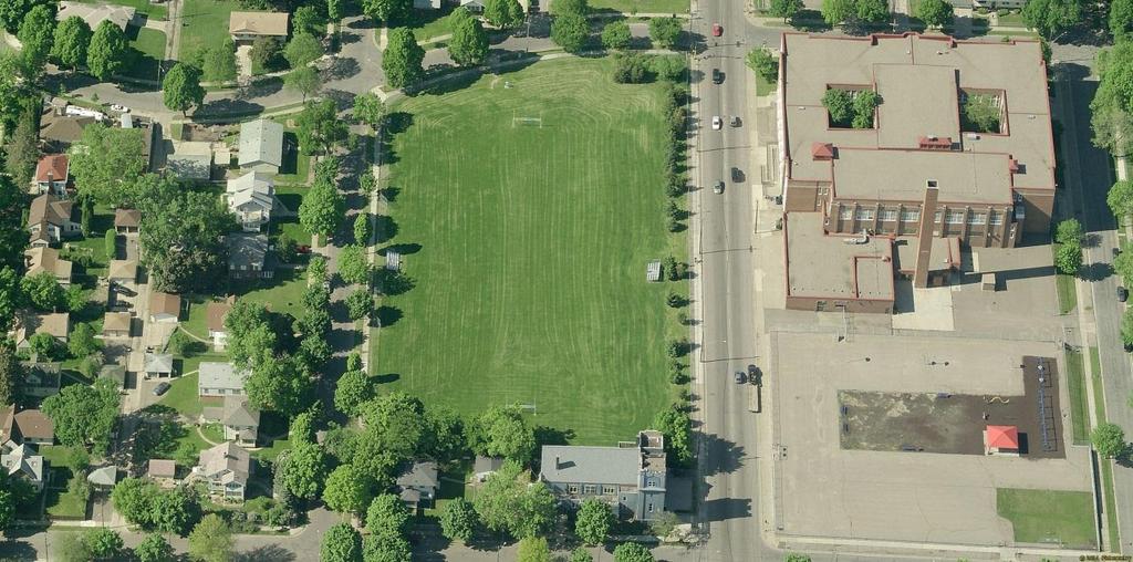 Minneapolis Public Schools athletic field with Lincoln Community School and playground to the east Alignment D Common Section Harrison Park is located south of the TH 55 service road and west of