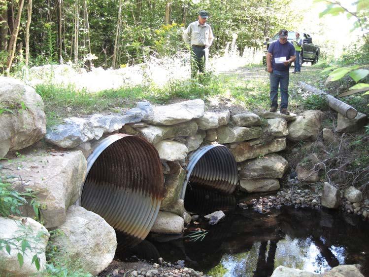 Metal culverts are generally cheaper than plastic ones and their weight can keep the frost from shifting them.