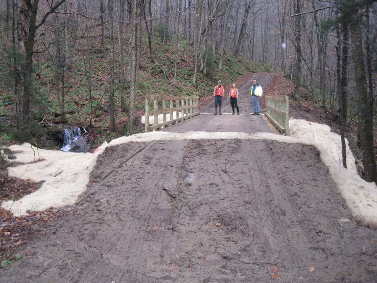 Diverting water away from the bridge is critical to preventing erosion.