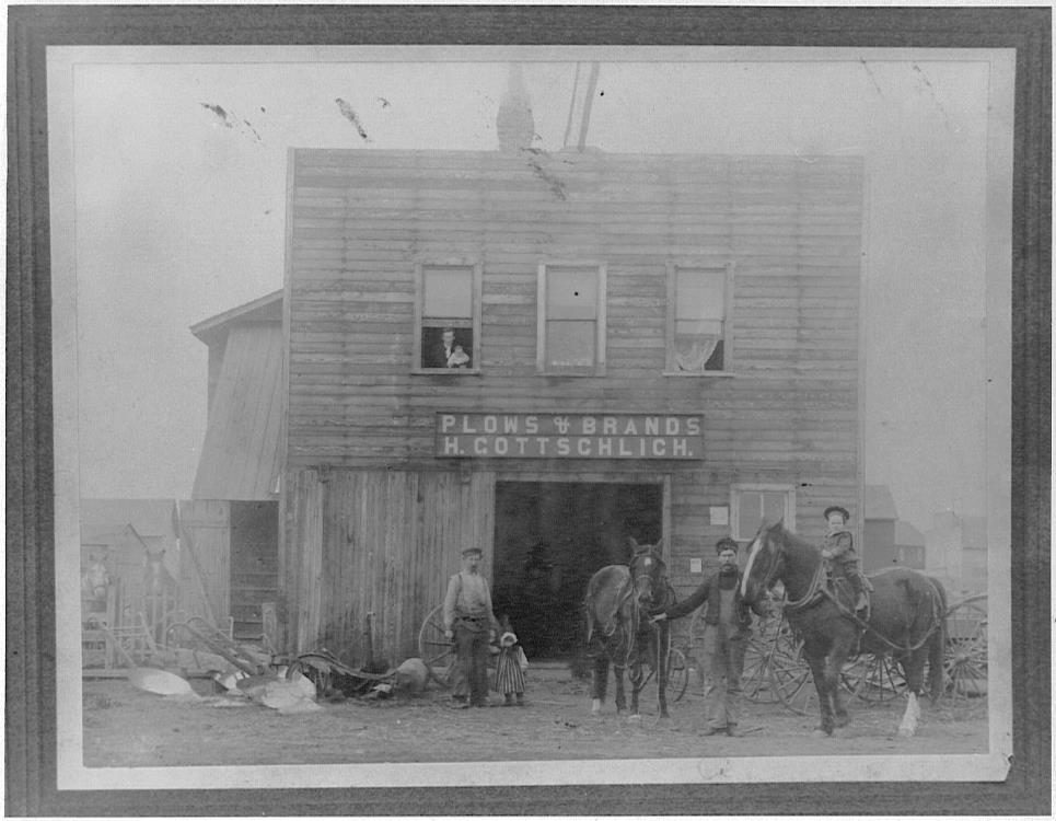 5. Plows & Brands Mural 51st Street & 50th Avenue Back Alley In 1896, the first blacksmith shop was open in Lacombe. It was owned by John Fincham.