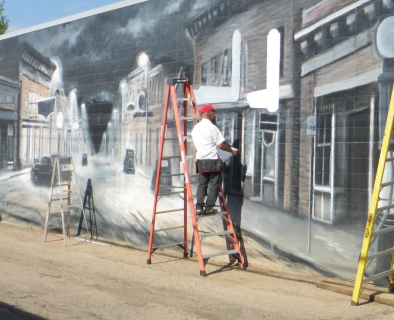 His murals are based on historic photographs provided by the Lacombe & District Historical Society, though as an
