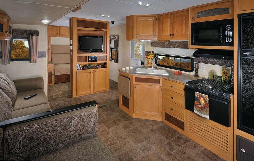 Hornet's kitchen comes complete with raised panel solid wood cabinet doors, oversized kitchen sink with high-rise faucet, and large pantry.