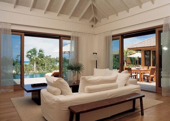 Point House Point House Living Room Rocky Point Living Room Accommodation COMO PARROT CAY ESTATE Point House: This 5,135 sq ft (477 sq m) three-bedroom villa features one master bedroom, with