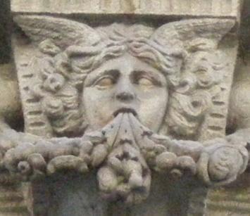 They are decorative motifs over some buildings main entrance (1 and 2)