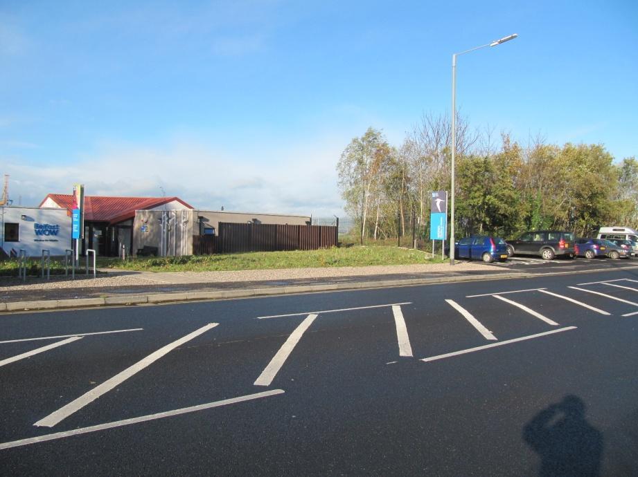 There is normal street lighting along the road. The car park is the only drop-off point. There are no steps between the car park and the visitor centre.