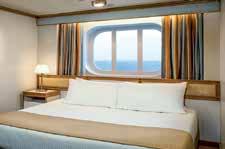 MINI-SUITE WITH BALCONY All the fine amenities of a Stateroom plus: with 2-4 chairs, table and ottoman Luxury mattress topper and pillows Bathroom