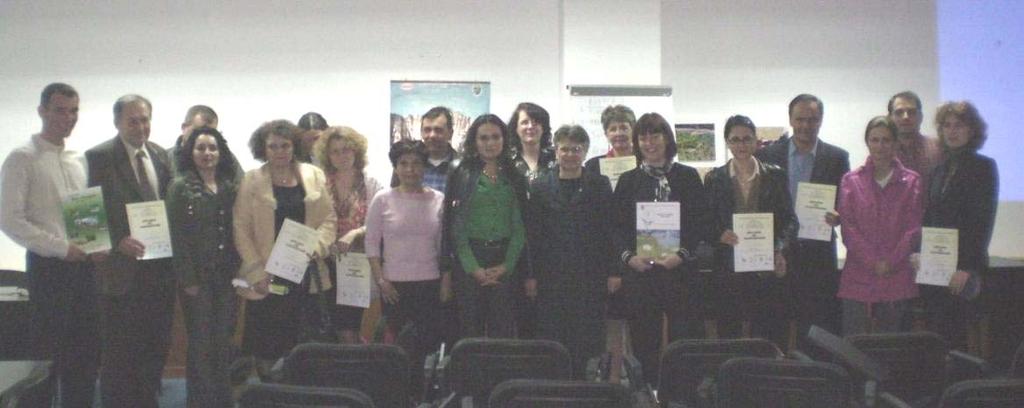 The participants at the workshop with a document certifying their participation at the training course.