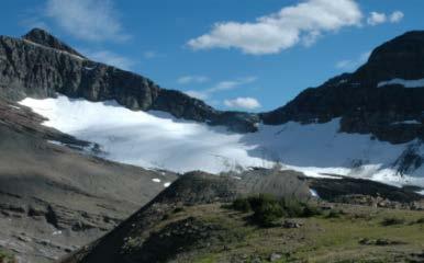 to the valley whereas Chaney Glacier is now confined to a small patch below the ridge in the 2005 photograph.