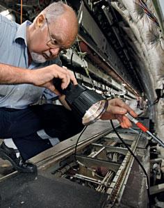 Caracho 09 15 Years of Porsche Consulting When all built-in components have been removed, an employee inspects the entire structure of the plane Lufthansa Technik Lufthansa Technik AG is one of the