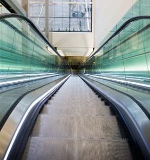 There are travelators to make your journey quicker, but there is space in the walkway to walk if you