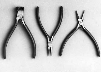 Pliers and cutters These flat nosed pliers have smooth jaws and plastic covered handles. They are 120 mm long, with box joint and single spring.