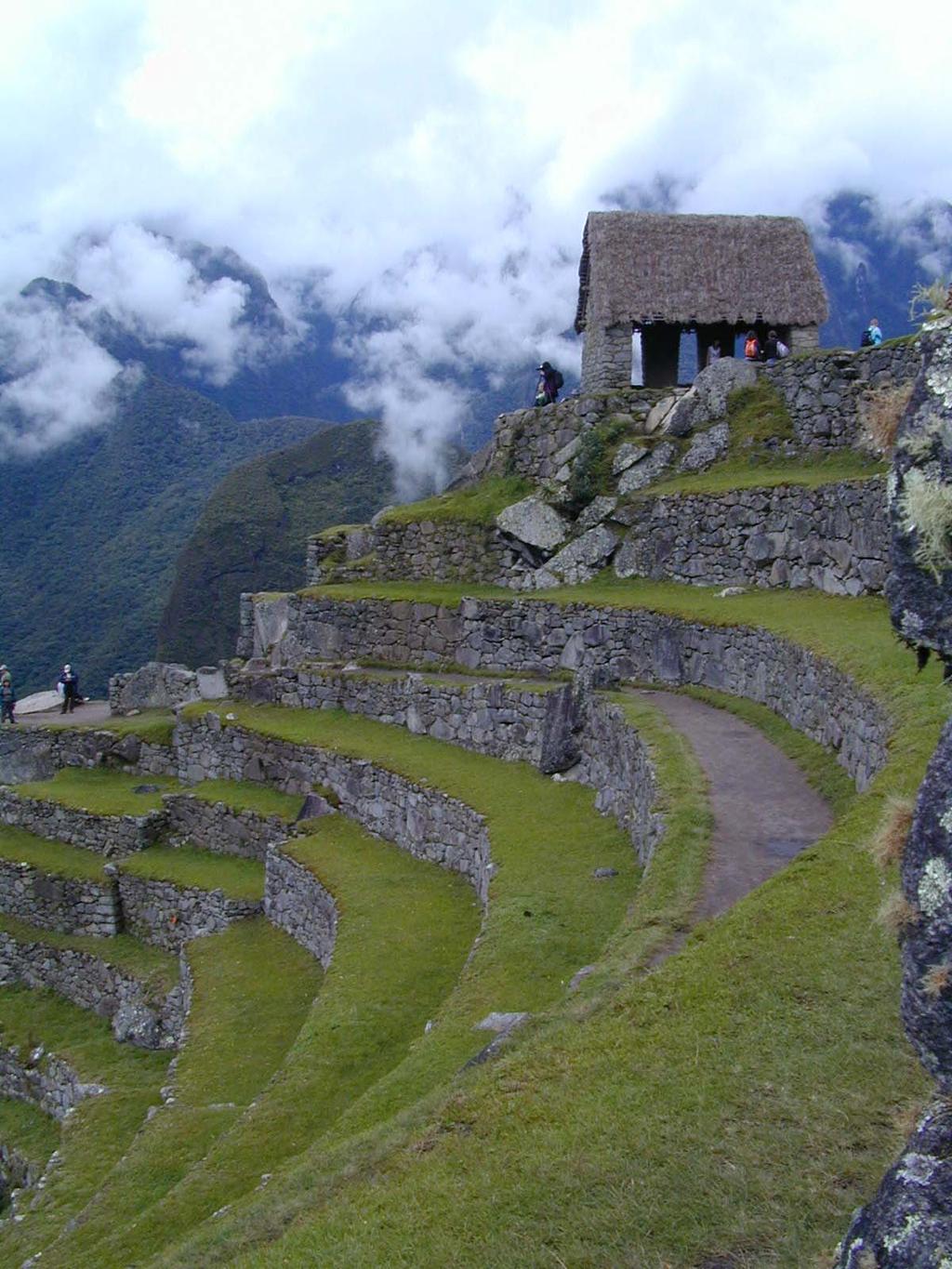 A view of the Machu Picchu sentry house and some of the agricultural terraces below its west side, before the clouds drifted away.