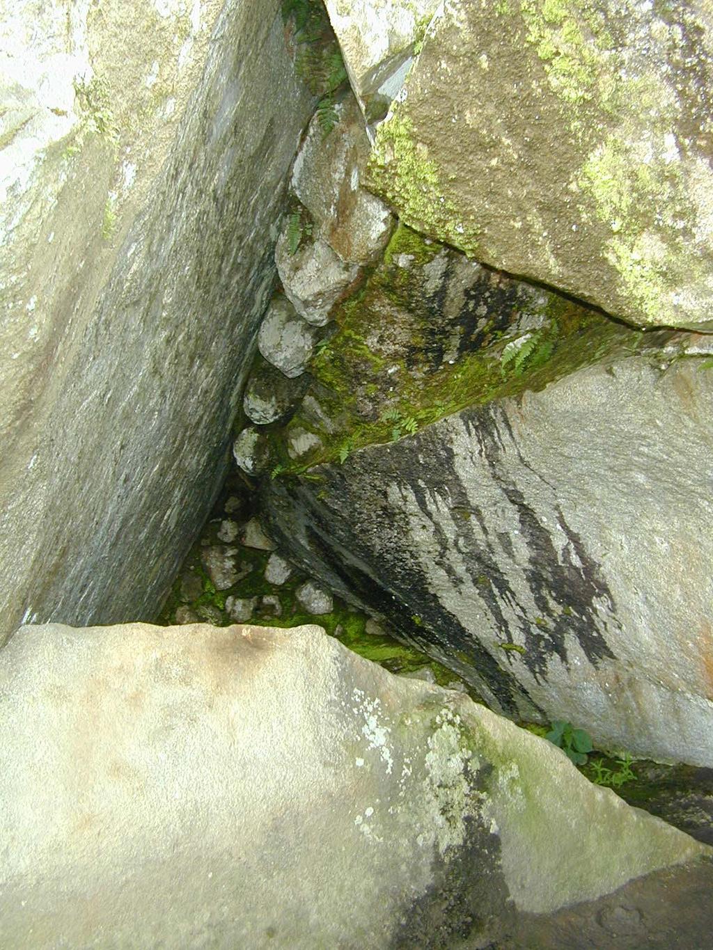 Some of these secret places beneath the boulders were enlarged.