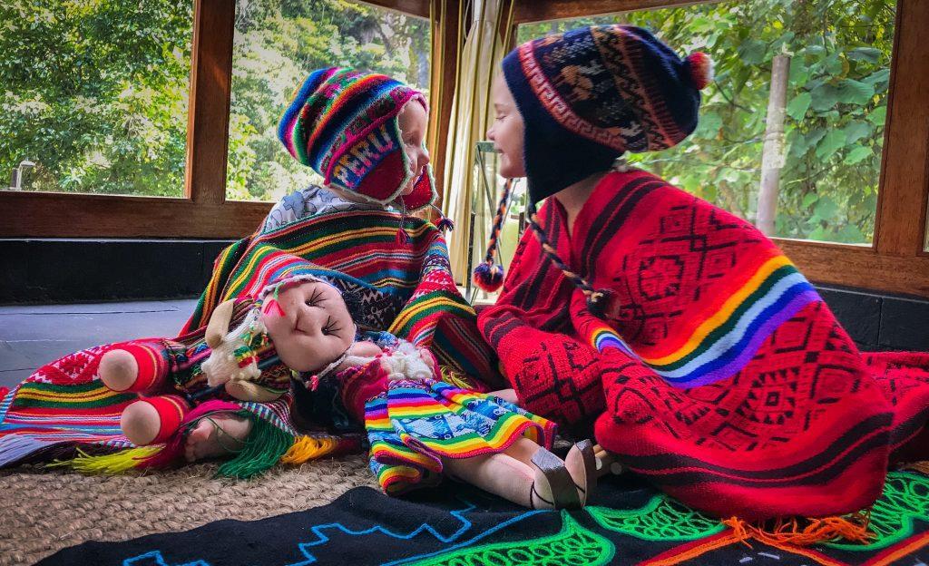 STORY TIME In the afternoon, Sumaq Hotel, set the garden room with gorgeous colourful throws on the floor, big cushions and lots of traditional attire. Like hats, musical instruments and dolls.