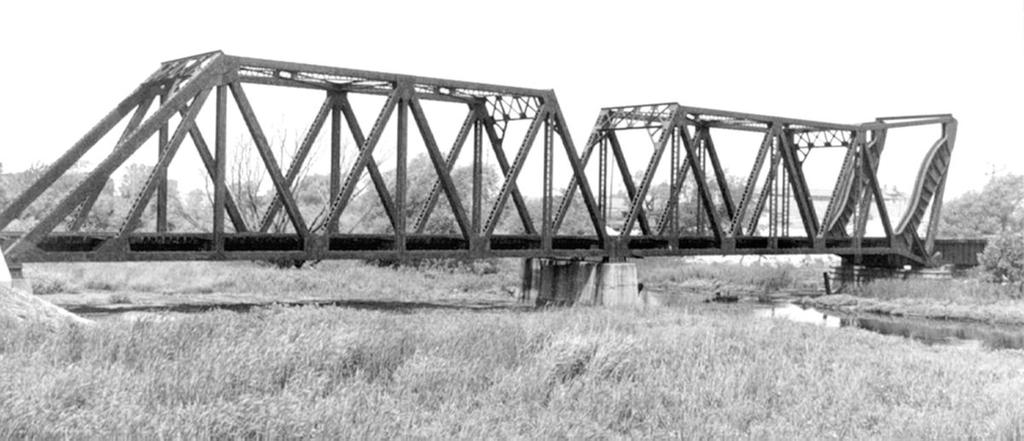 A photo from 2010 showing the abandoned Chicago, Indianapolis, and Louisville Railroad Bridge Over Grand Calumet River in Hammond, Indiana. The span to the right is the Page bascule bridge.