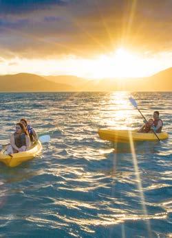TWILIGHT KAYAK TOUR Paddle to Lovers Cove where you will be served a glass of sparkling wine whilst watching the sun go down. Wild fish feeding at Lovers Cove.