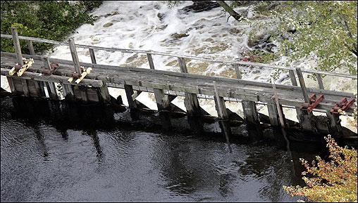 AFP/Getty Images The 173-year-old wooden dam holding water.