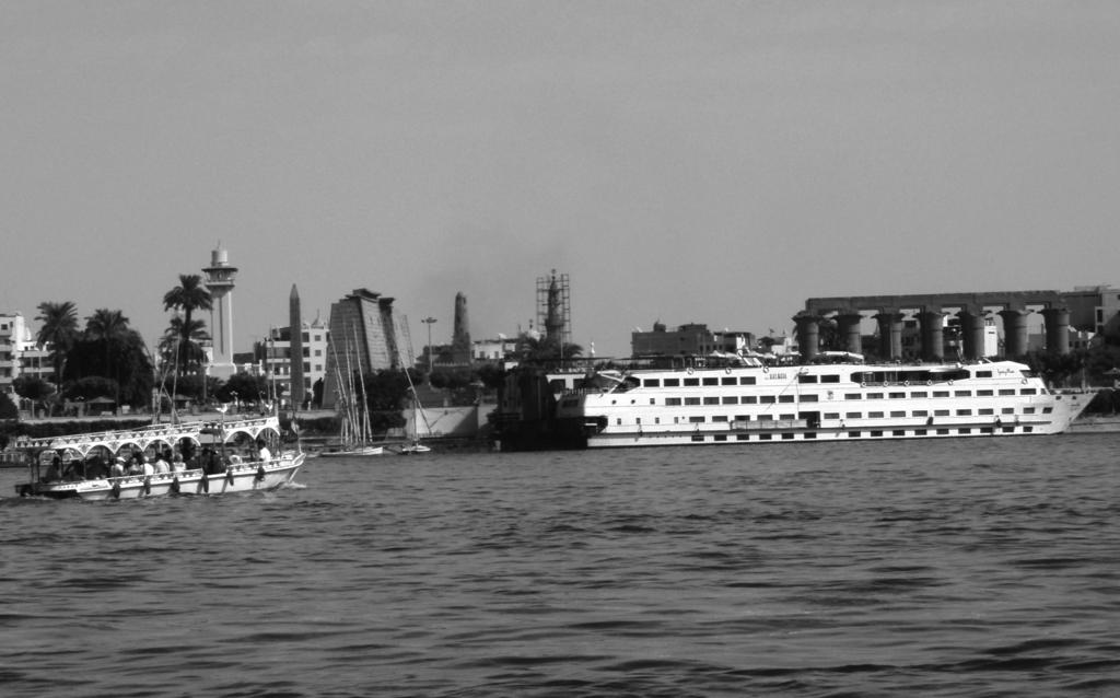 16 (d) Fig. 4 is a photograph taken along the River Nile in Egypt. Fig. 4 Many rivers attract a variety of tourists.