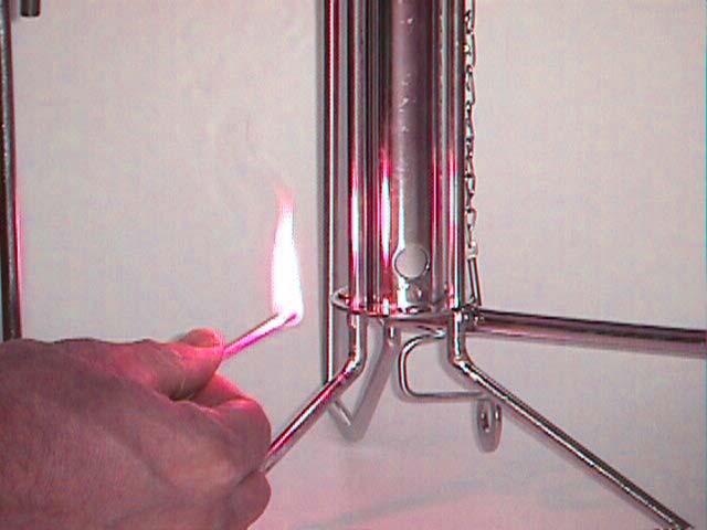 Matches: Place a lighted match or lighter flame into the lighting hole on the lower side of the burner as shown in photograph 8.