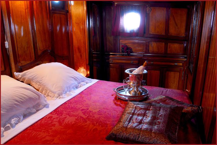 The Captain s cabin has its own entrance onto the main deck, and is exquisitely fitted with the original mahogany panelling and cabinets.