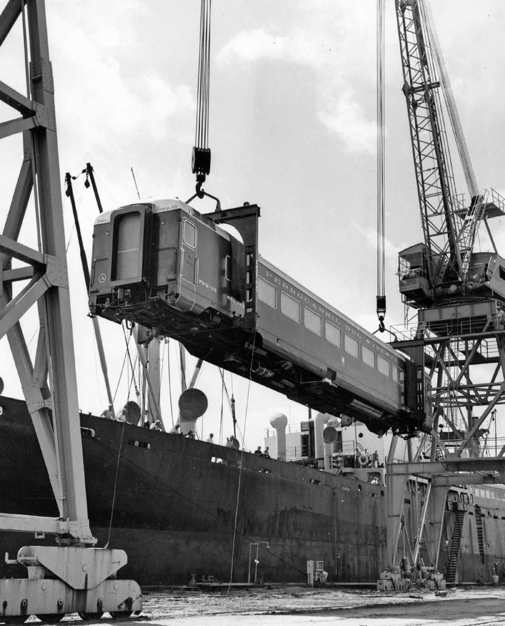 Even trains can travel by sea. Crane operators unload a railroad car for the Mexican railroad company Ferrocarril del Sureste, circa 1950s.