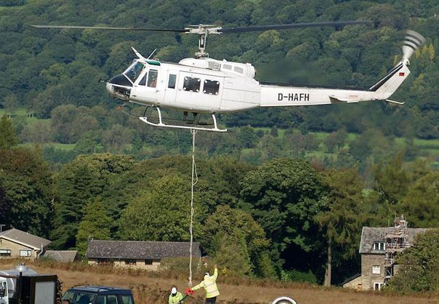 Bell 205 D-HAFH operated on Ilkley Moor, lifting stones for a full week in August(David Blacker) LINTON-ON-OUSE:- Visiting on the morning of 31.8 were G-ACUS DH.85, G-ALWB DHC.1, G- AZGY CP.