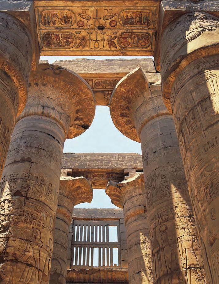 Egyptian architects used their knowledge of proportion and shapes to create these impressive columns in the temple of Amun Re at Karnak. The columns were decorated with hieroglyphs and carved figures.