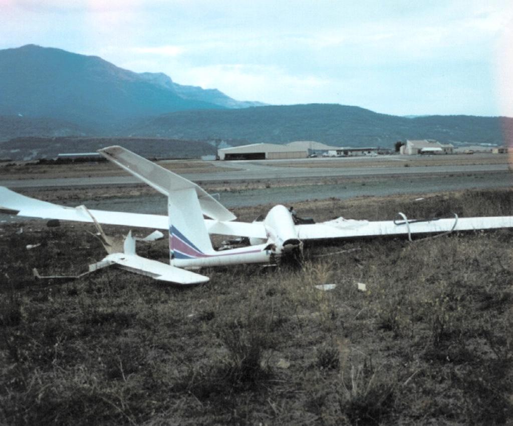 Figure 3 is a photograph showing the wreckage seen from the rear part of the fuselage and in a direction approximately perpendicular to the trajectory.