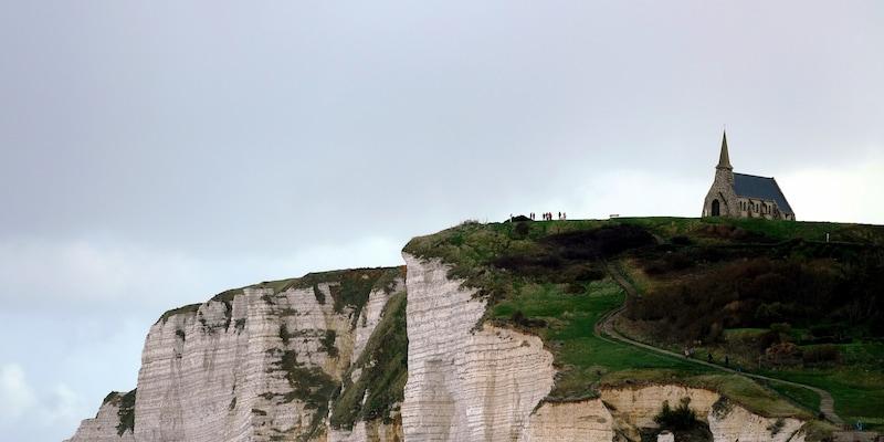 Étretat Cliffs Hike Take in the breathtaking views as you hike at the beautiful seaside commune and farming town of Étretat, known for its stunning chalk cliffs, which include three natural arches