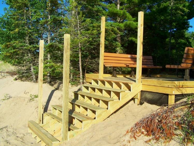 The walls will help protect the stairs from wind and waves, as will the large rock that will be placed nearby in the future.