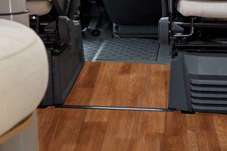 The floor space between the driver and front passenger seats is equipped with a sturdy,