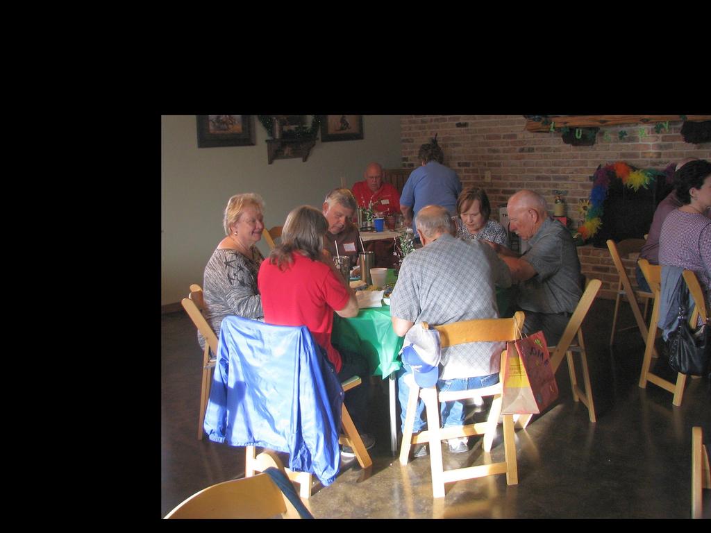 Several groups played cards during the days and visited inside due to the windy spring days.