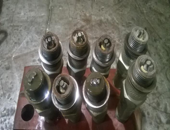 3) Spark plugs of all the cylinders tested and found  4) All
