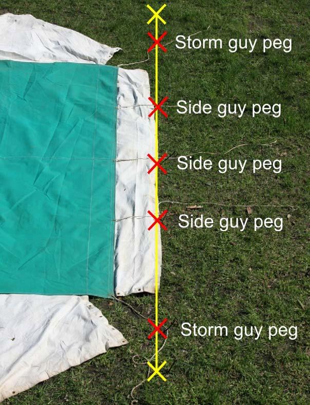 Three side pegs are positioned with each peg adjacent to the eyelet with a guy rope attached to it along each side of the tent.