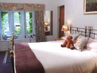 Successfully combining antique and modern, the rooms have Victorian brass beds, beamed ceilings and