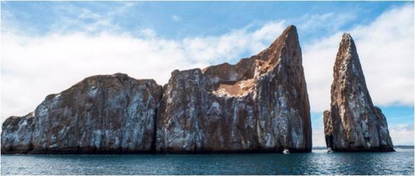 Day 7 morning still Kicker Rock, San Cristobal Island Kicker Rock or León Dormido, named for its characteristic shape similar to a boot or sleeping lion, is a dramatic sight with the remains of a
