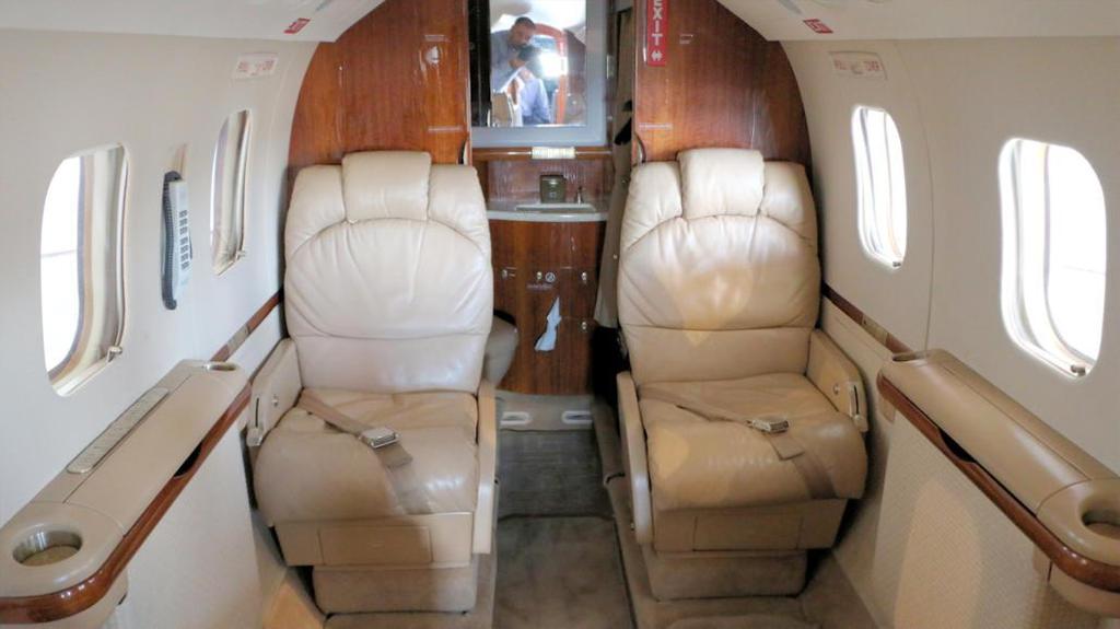 INTERIOR: 7 Passenger Executive Interior Belted Lav seat certified for take-off Aft Club Seating Forward LS 2-Place Divan Single Forward-Facing Seat Forward RH Galley DVD/CD,