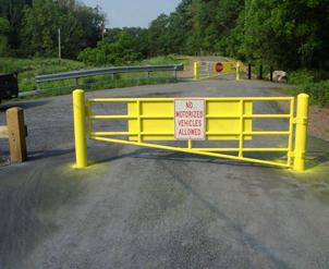signage or flagging to ensure trail users recognize the location of the fence. Gates Gates made of wood or steel allow passage and may or may not swing open.