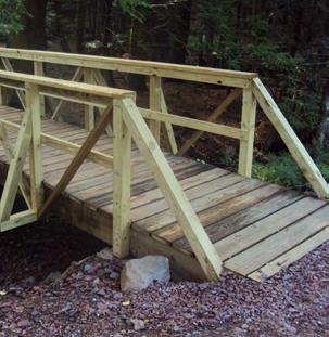 The USDA Forest Service identifies six general bridge types in their Trail Bridge Catalog 14, available here, typically used along non-motorized trails, including: Cable Suspension Bridge: Cable
