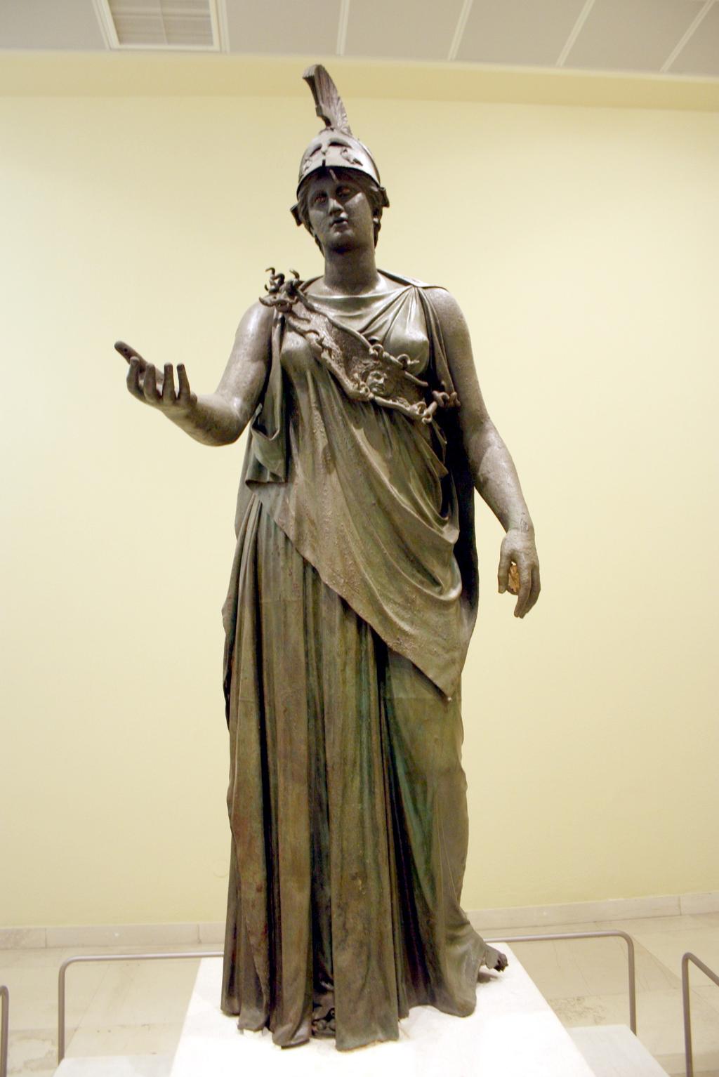 30 It features a peplos open on her right side as well as a band-like aegis. 31 This aegis features a gorgoneon portrayed as medusa just like the Athena Polias Piraeus Athena Image credit: https://en.
