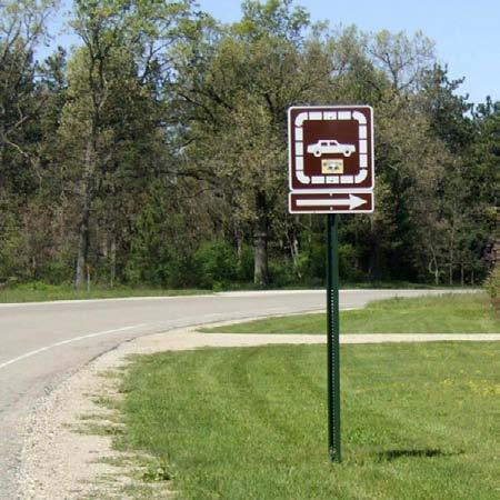 At each turn in the route, you will also see a Heritage Trail directional marker like the one shown at the lower right.