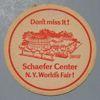 Lot # 380 - "Schaefer Beer" Coaster with a picture of the pavilion with "Don't miss it', "Schaefer Center N.Y. World's Fair!". Size: 3 1/2" diameter.