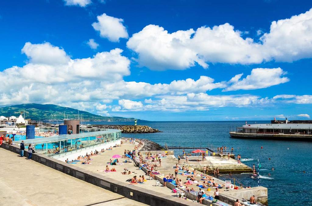 CLOCKWISE FROM THIS IMAGE: A typical summer s day in Ponta Delgada; The pace is leisurely at the city s modern waterfront precinct; A small chapel, Ermida de Monte Santo, is flanked by the island s