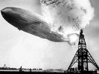 At 7:00 pm EST, a recommended immediate landing was released - by 7:21 pm, the first mooring line was dropped. An eerie, hazy glow illuminated the massive airship's swastika emblem.