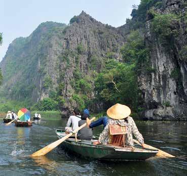 Venture into caves and waterways by boat in stunning Ninh Binh and drive through the terraced rice paddies of the Central Highlands to see tea and coffee plantations, waterfalls and colourful